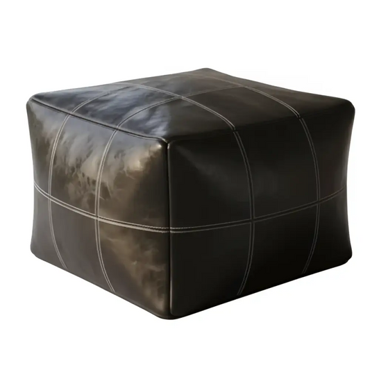 Black leather ottoman with patchwork design on a white background